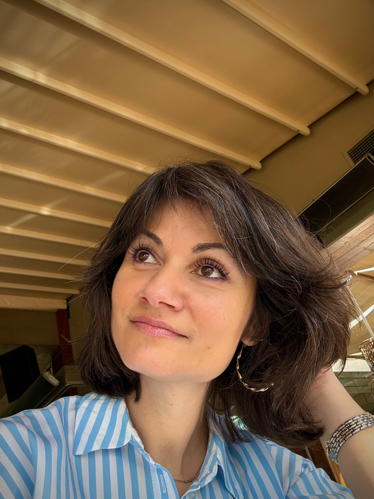 Aurora Gartrell, life coach, smiling in warm daylight